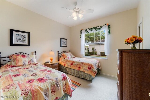 bedroom featuring carpet flooring, a ceiling fan, and baseboards