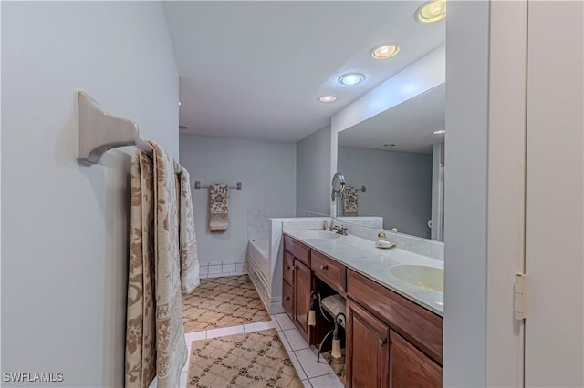 bathroom with tile patterned flooring, recessed lighting, double vanity, and a sink