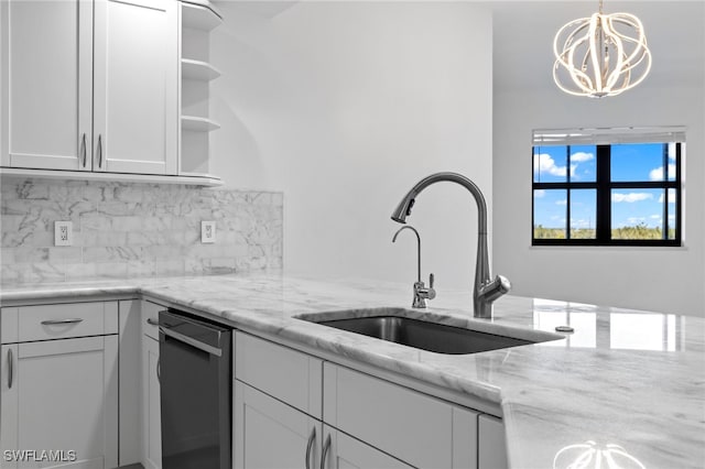 kitchen with open shelves, light stone counters, backsplash, and a sink