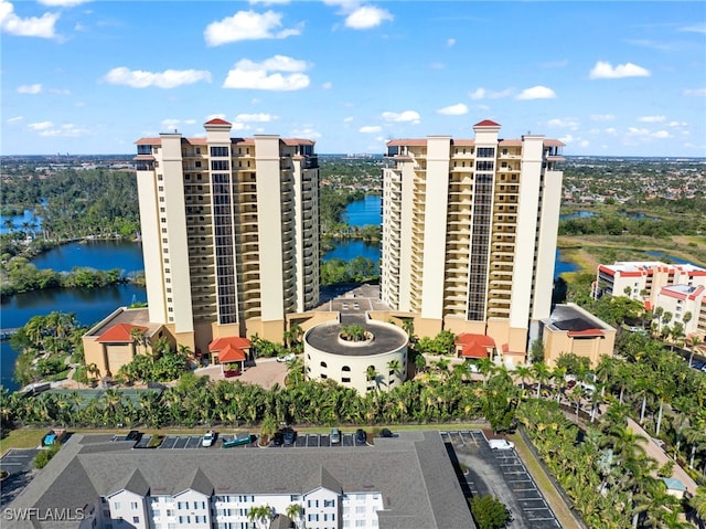 view of building exterior with a view of city and a water view