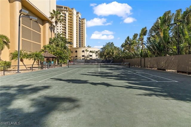 view of sport court with fence