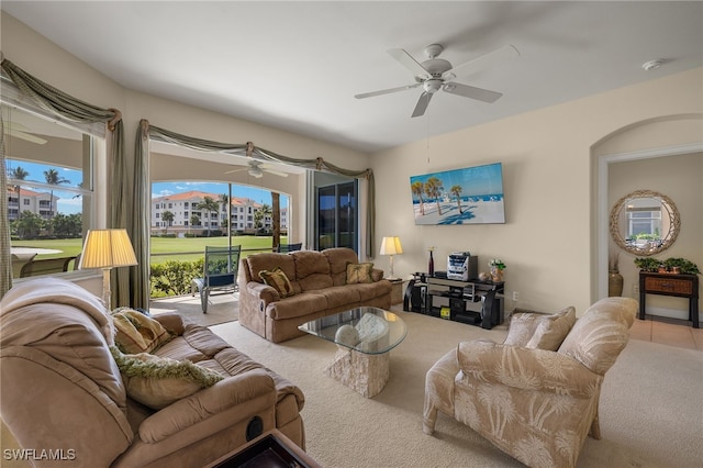 carpeted living room featuring ceiling fan