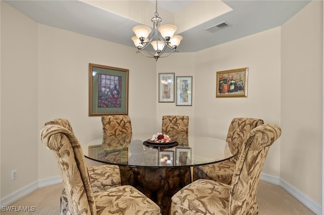 dining area with carpet, visible vents, and baseboards