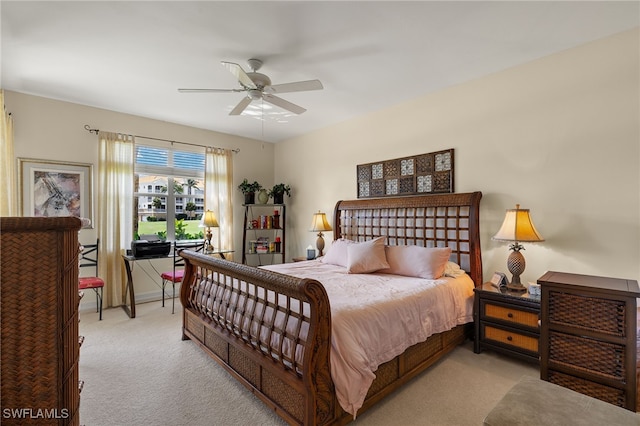 bedroom featuring a ceiling fan and light carpet