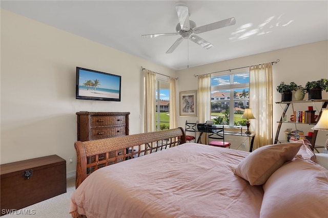 bedroom with access to outside, ceiling fan, and carpet