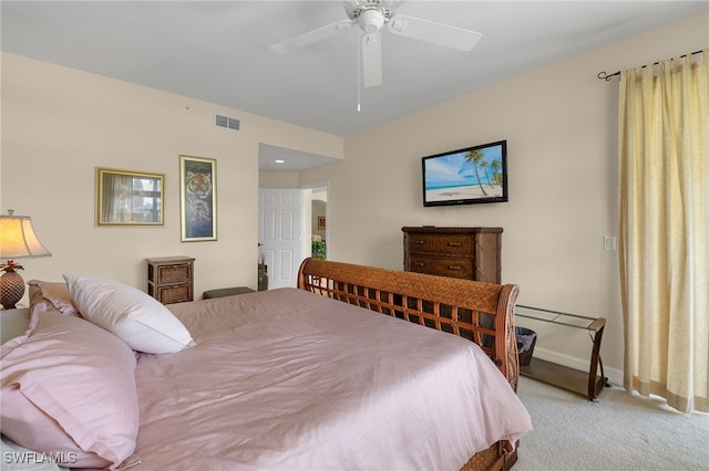 bedroom with carpet floors, a ceiling fan, visible vents, and baseboards