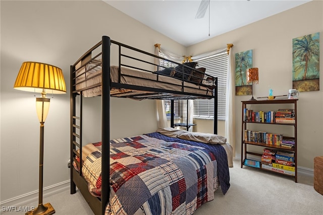 bedroom with carpet floors, baseboards, and a ceiling fan