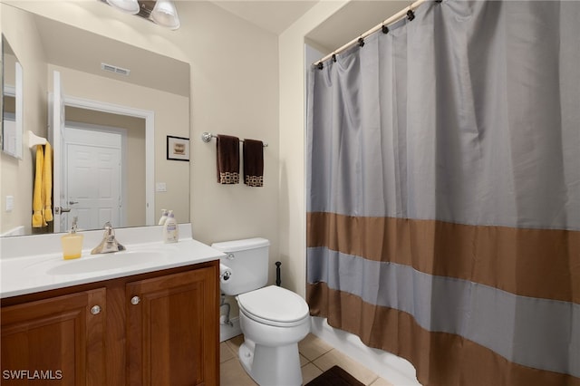 bathroom with visible vents, toilet, a shower with curtain, tile patterned floors, and vanity