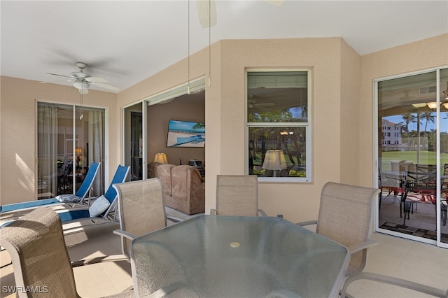 view of patio featuring a ceiling fan and outdoor dining space