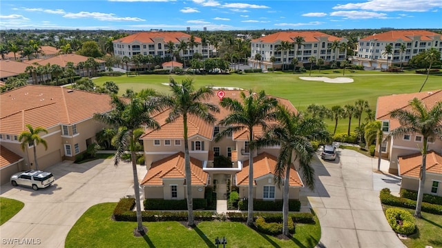 bird's eye view with view of golf course and a residential view