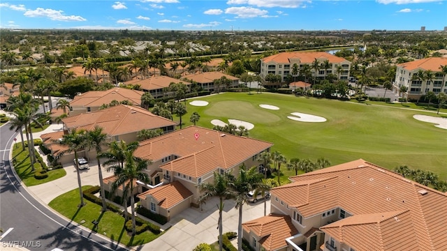 bird's eye view with golf course view and a residential view