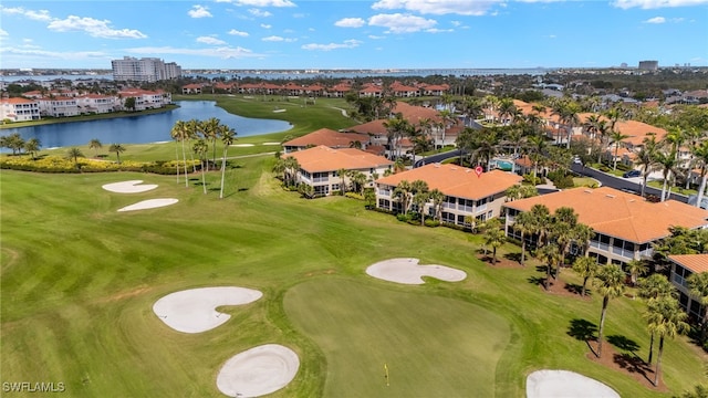 aerial view featuring a water view and golf course view