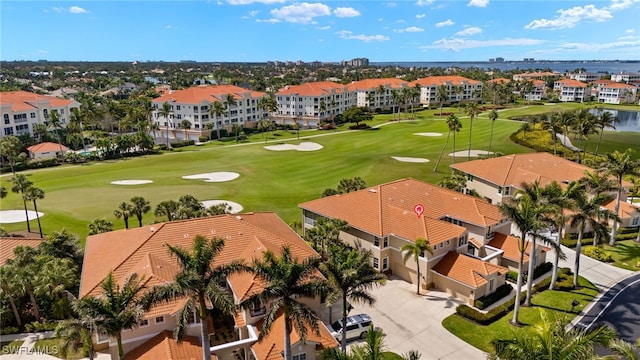 aerial view with a water view, a residential view, and golf course view