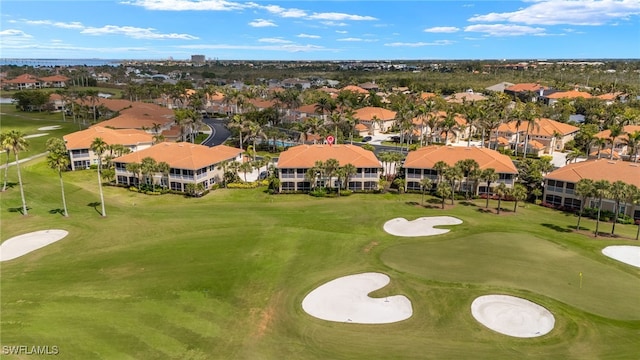 drone / aerial view with a residential view and golf course view