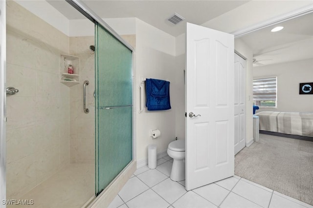 full bathroom with visible vents, toilet, a stall shower, tile patterned floors, and a ceiling fan