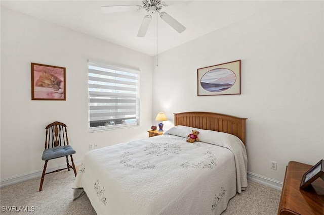 carpeted bedroom with a ceiling fan and baseboards