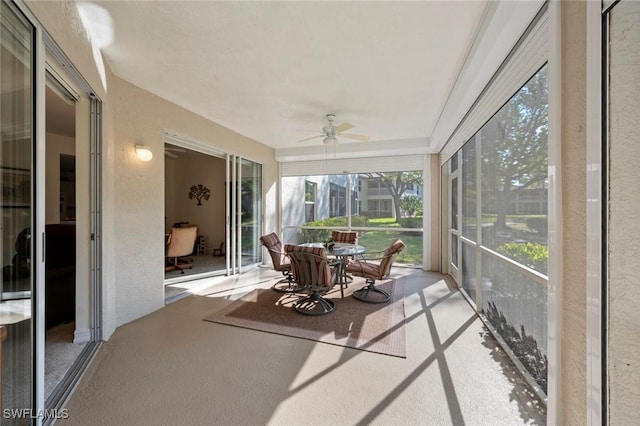 sunroom with a ceiling fan