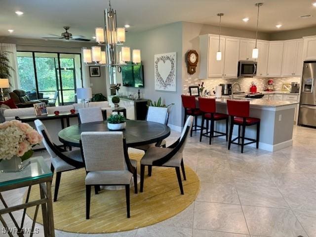 dining room featuring recessed lighting, ceiling fan, and baseboards