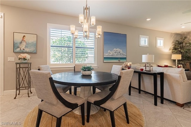 7658 Jacaranda Ln, Naples, FL 34114 - dining space with light tile patterned floors, baseboards, and a chandelier