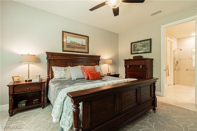 7658 Jacaranda Ln, Naples, FL 34114 - bedroom with baseboards, visible vents, ensuite bathroom, and ceiling fan