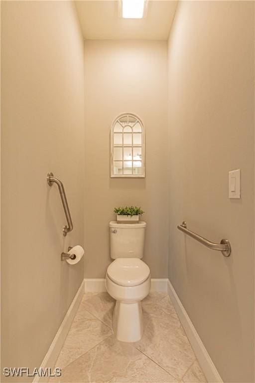 7658 Jacaranda Ln, Naples, FL 34114 - half bathroom with baseboards and toilet