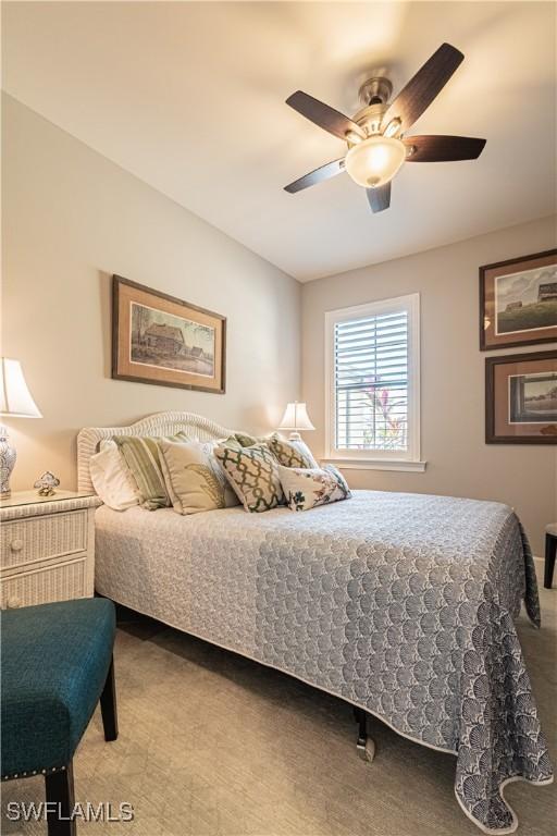 7658 Jacaranda Ln, Naples, FL 34114 - bedroom with ceiling fan