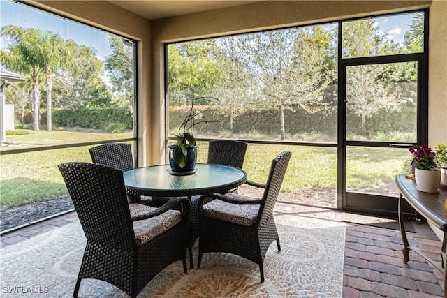 7658 Jacaranda Ln, Naples, FL 34114 - sunroom featuring outdoor dining area