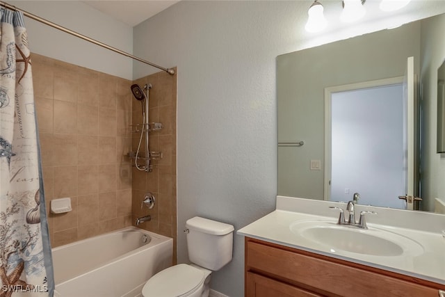 bathroom featuring shower / bath combo, vanity, and toilet