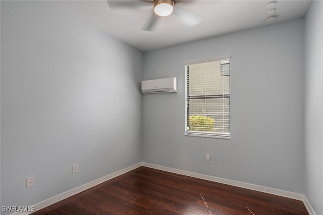 spare room featuring a ceiling fan, dark wood finished floors, baseboards, and a wall mounted AC