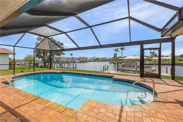 pool featuring a boat dock, glass enclosure, boat lift, a water view, and a patio area