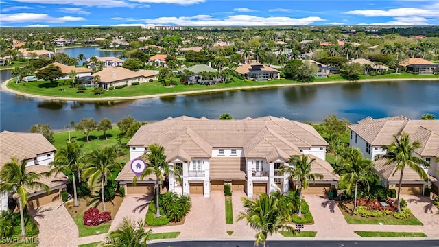 birds eye view of property featuring a residential view and a water view