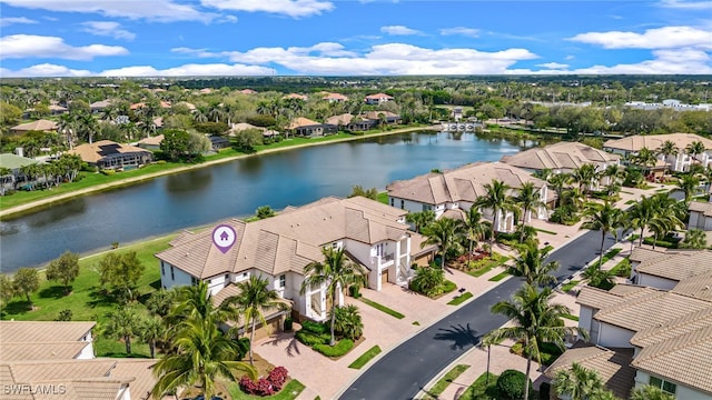 aerial view featuring a water view and a residential view