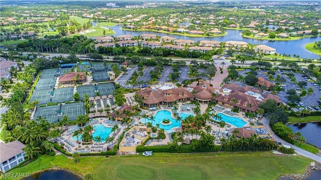 birds eye view of property with a residential view and a water view