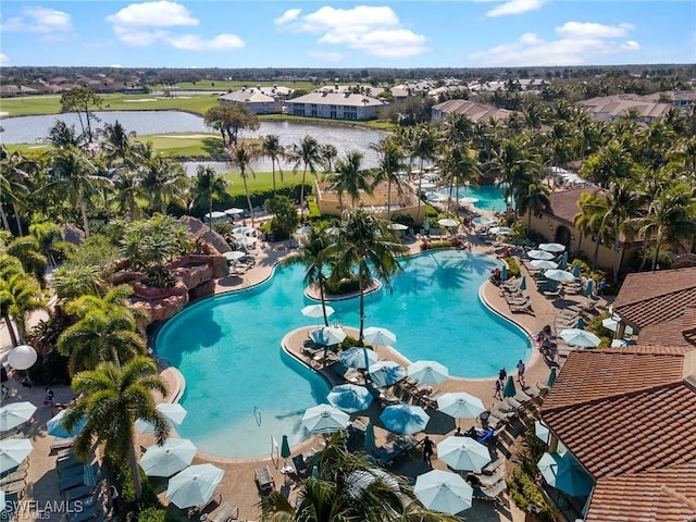 pool with a water view and a patio