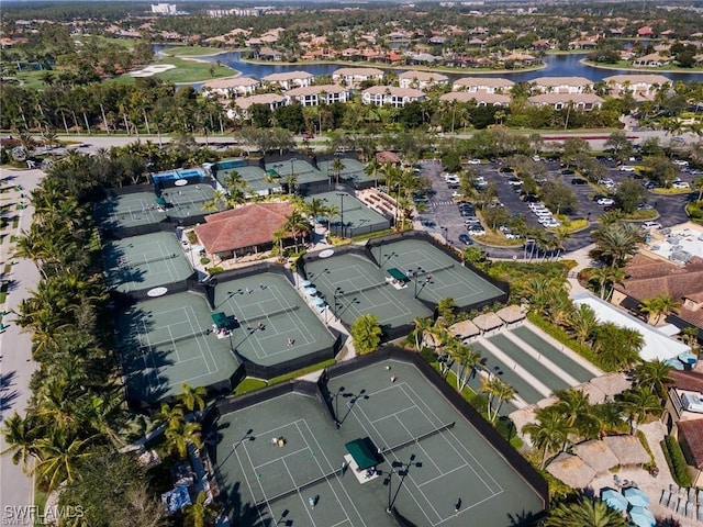 bird's eye view featuring a residential view and a water view