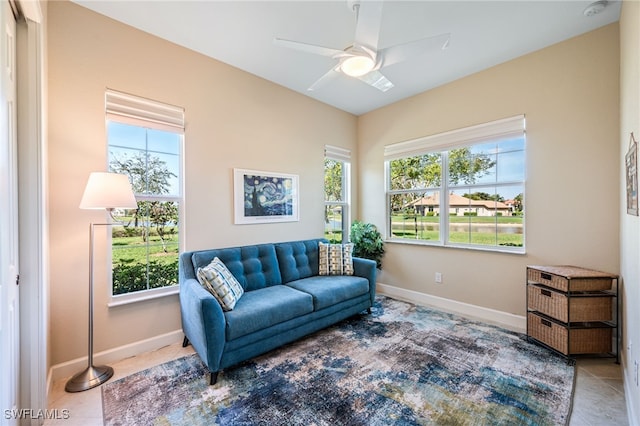 sitting room with baseboards and a wealth of natural light