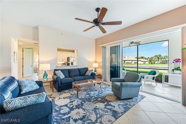 living room featuring light tile patterned floors and ceiling fan