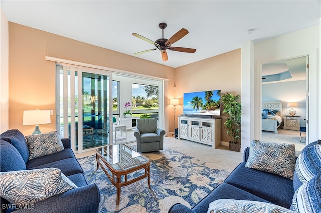 living room featuring ceiling fan and tile patterned floors