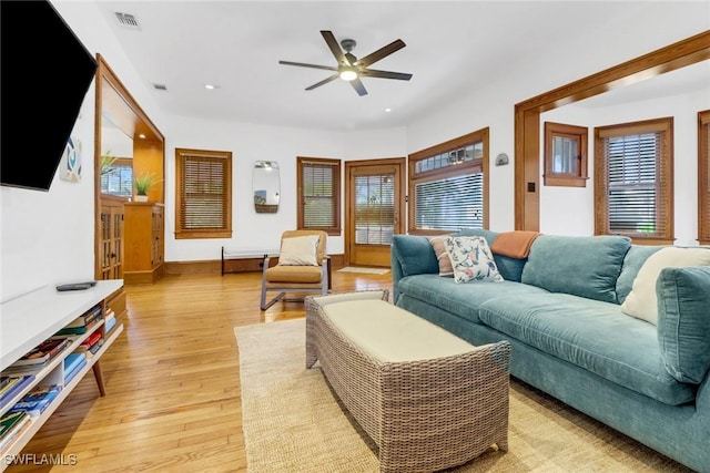 living room with ceiling fan, recessed lighting, visible vents, baseboards, and light wood finished floors