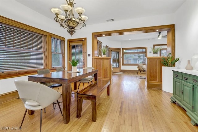 dining room featuring visible vents, a notable chandelier, and light wood-style flooring