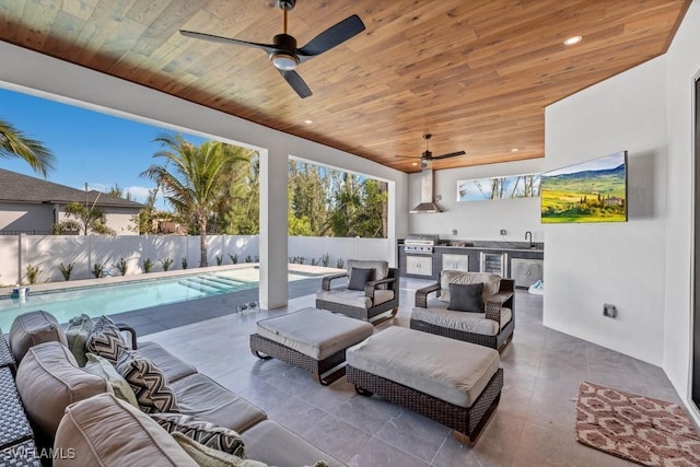 view of patio with an outdoor hangout area, a fenced backyard, area for grilling, and a sink