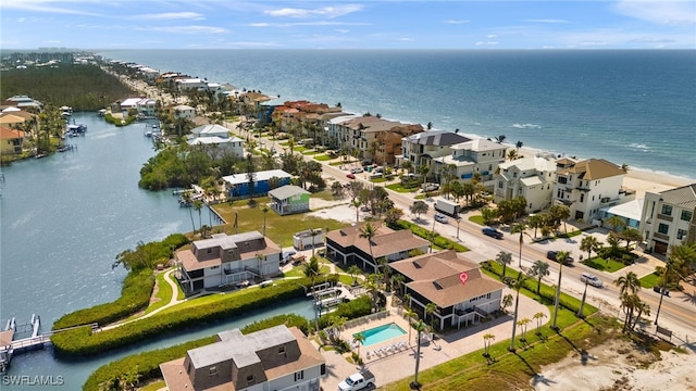 birds eye view of property with a residential view and a water view