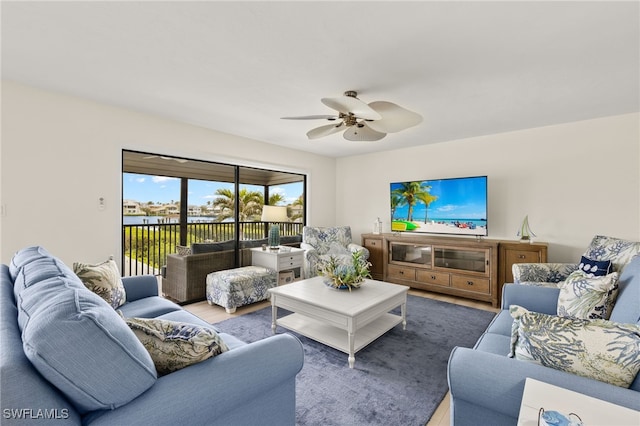 living area featuring wood finished floors and a ceiling fan