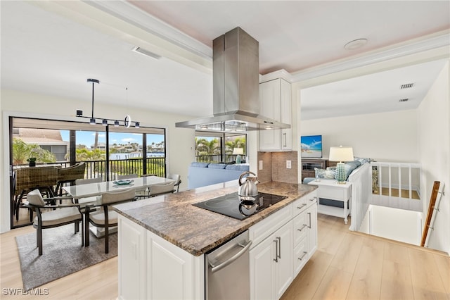 kitchen featuring visible vents, island exhaust hood, light wood finished floors, black electric stovetop, and light stone countertops