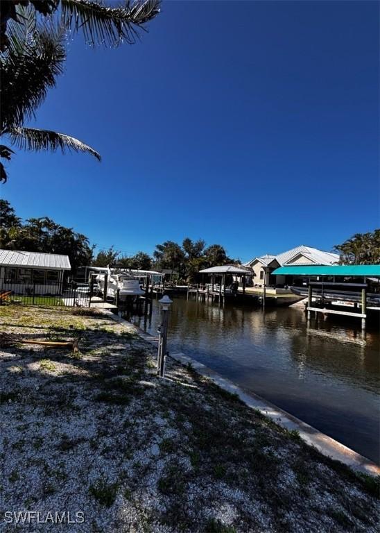 dock area featuring a water view and boat lift