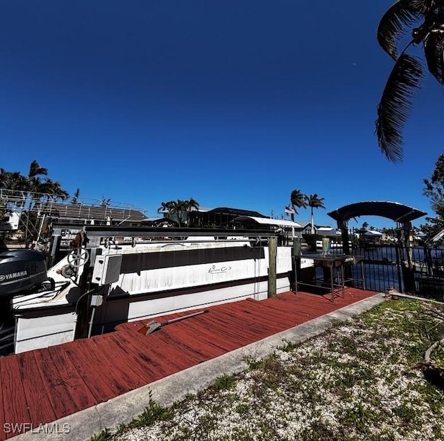 view of dock with boat lift