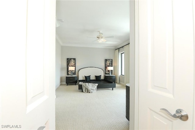 bedroom with baseboards, ornamental molding, a ceiling fan, and light colored carpet