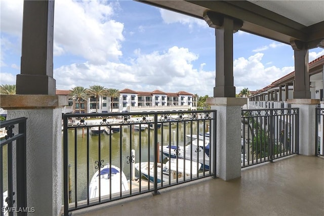 balcony featuring a water view