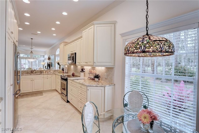 kitchen featuring pendant lighting, light stone counters, stainless steel appliances, tasteful backsplash, and crown molding