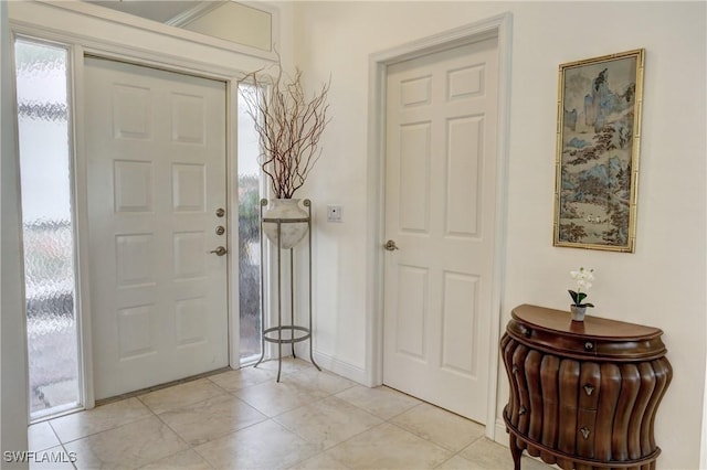 foyer entrance featuring light tile patterned floors